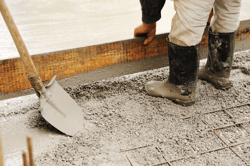 concrete worker laying a slab